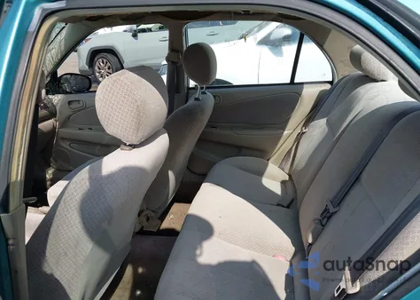 1999 Toyota Corolla Ce из США, поврежденный, VIN 2T1BR12E6XC134802